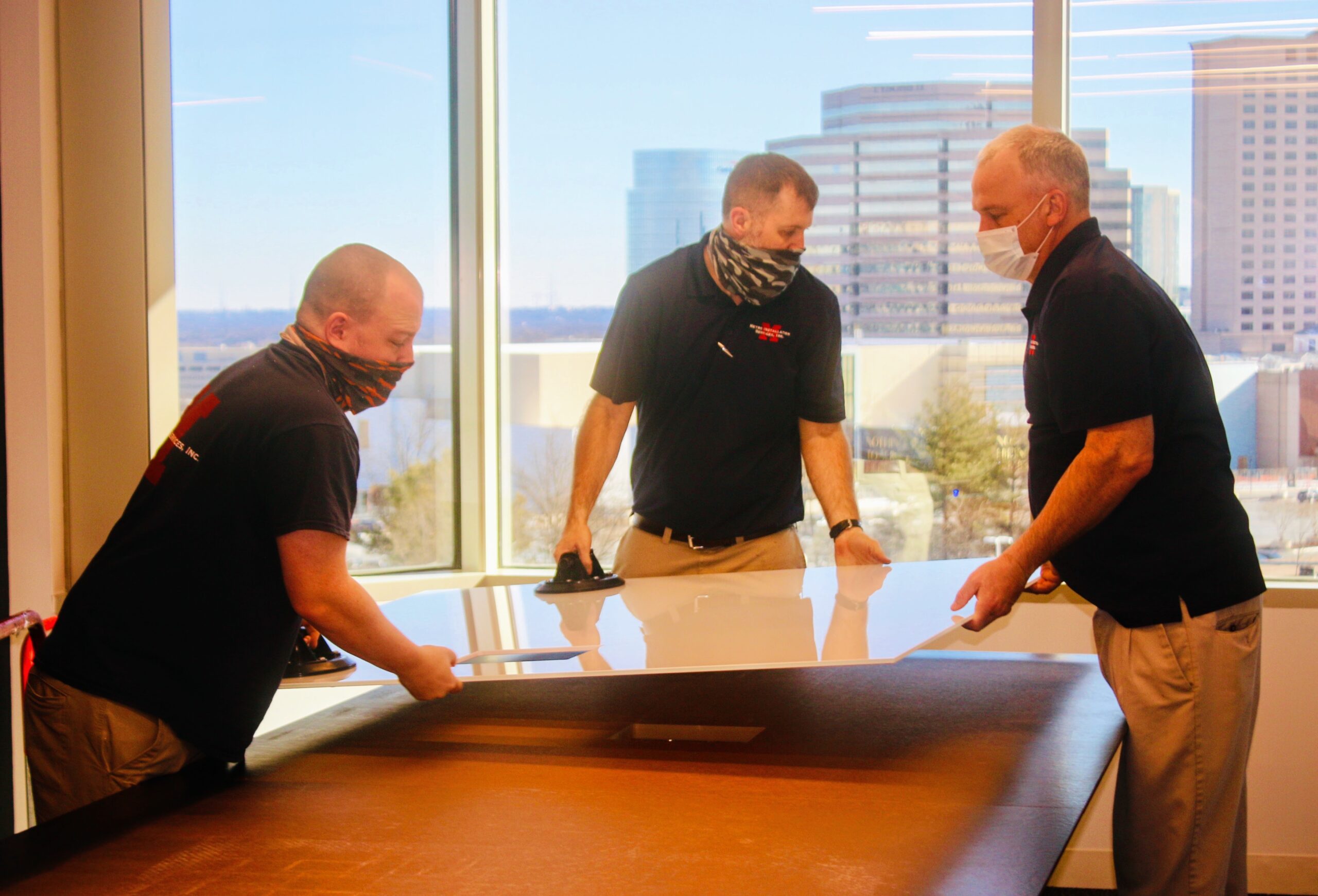 Metro installers assemble conference table